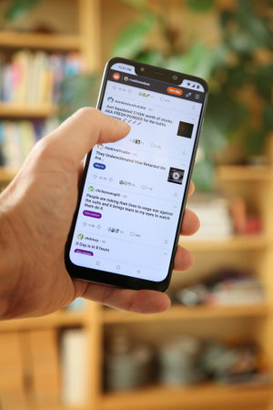 WARSAW, POLAND - JANUARY 29, 2021: User browsing Reddit social sharing website WallStreetBets...