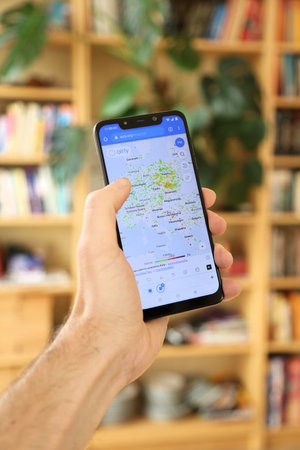 WARSAW, POLAND - JANUARY 29, 2021: User browsing Airly air pollution monitoring website on an Android OS, Xiaomi brand smart phone.のeditorial素材