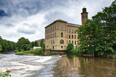 Saltaire former textile mill (Salts Mill) in Victorian model village in Shipley (England) listed as UNESCO World Heritage Site.のeditorial素材