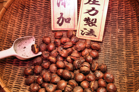 KYOTO, JAPAN - APRIL 14, 2012: Roasted chestnuts stall in Kyoto city, Japan. It is a typical street food in Kyoto.のeditorial素材