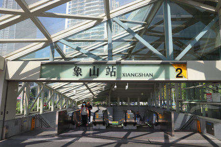 TAIPEI, TAIWAN - DECEMBER 3, 2018: People exit MRT station in Xiangshan, Taipei. Taipei Mass Rapid Transit (MRT) branded as Taipei Metro serves 746 million annual rides.のeditorial素材