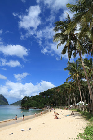 PALAWAN, PHILIPPINES - DECEMBER 2, 2017: People enjoy Marimegmeg beach of El Nido in Palawan island, Philippines. 6 million foreign tourists visited Philippines in 2016.のeditorial素材