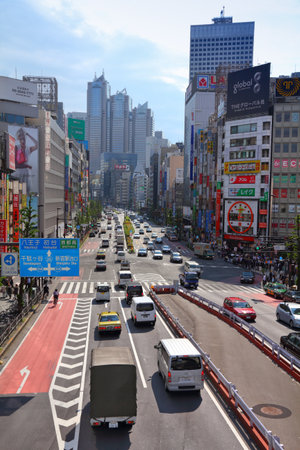 TOKYO, JAPAN - MAY 11, 2012: People drive in Shinjuku district, Tokyo. Shinjuku is one of the busiest districts of Tokyo, with many international corporate headquarters located here.のeditorial素材