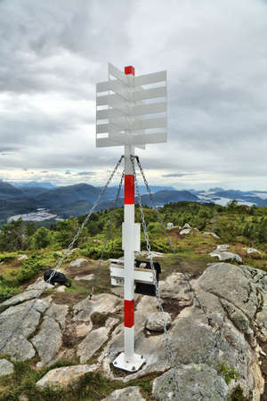 Trig marker on Nihusen mountain in Skodje, Norway. Trigonometric point for geodetic surveying.