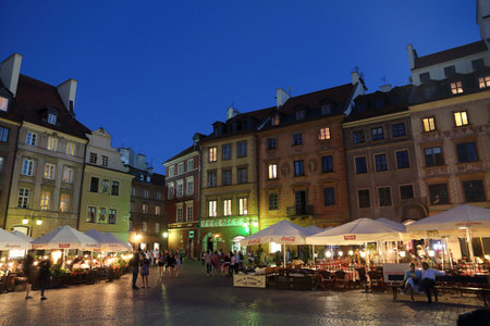 WARSAW, POLAND - JUNE 18, 2016: People visit Rynek main square in Old Town in Warsaw, Poland. Warsaw is the capital city of Poland. 1.7 million people live here.のeditorial素材