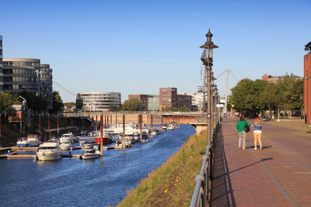 GERMANY - SEPTEMBER 18, 2020: People visit Inner Harbour (Innenhafen) in , Germany. Inner Harbour is a former industrial area redeveloped into culture and restaurant zone.のeditorial素材