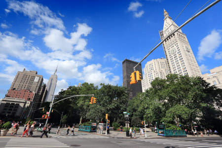 NEW YORK, USA - JULY 3, 2013: People cross the street in Flatiron District, Manhattan, New York....