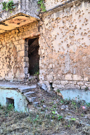 Mostar city in Bosnia and Herzegovina. Historic war damage from 1990s - bullet holes in residential building.の写真素材