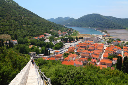STON, CROATIA - JUNE 20, 2021: Tourists visit Walls of Ston in Croatia. The walls are one of the longest preserved fortification systems in the world.のeditorial素材