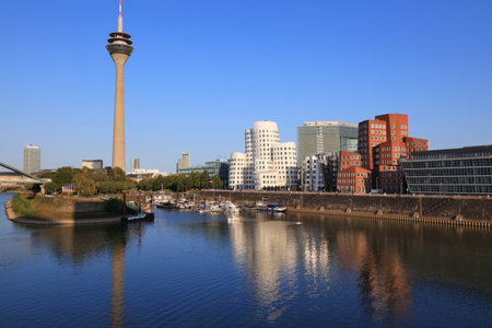 DUSSELDORF, GERMANY - SEPTEMBER 19, 2020: Skyline of Hafen district in Dusseldorf, Germany. The former harbor area was redeveloped into modern commercial-resindential district.のeditorial素材