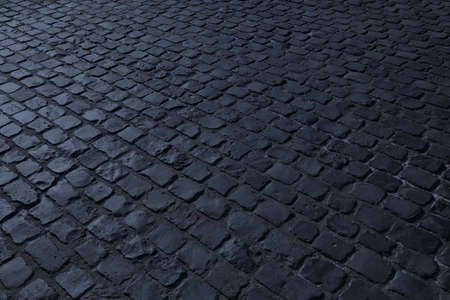 Stone paved street night view. Old stone pavement.の写真素材