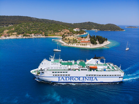 VIS, CROATIA - JUNE 22, 2021: Jadrolinija car ferry arrives at the island of Vis. Croatia had 18.4 million tourist visitors in 2018.のeditorial素材