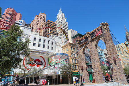LAS VEGAS, USA - APRIL 14, 2014: People visit the Strip in Las Vegas. 15 of 25 largest hotels in the world are located at the strip with more than 60 thousand rooms.のeditorial素材