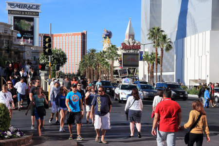 LAS VEGAS, USA - APRIL 14, 2014: People visit the Strip in Las Vegas. 15 of 25 largest hotels in the world are located at the strip with more than 60 thousand rooms.のeditorial素材