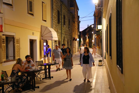SKRADIN, CROATIA - JULY 13, 2021: People visit Skradin Old Town. Croatia had 18.4 million tourist visitors in 2018.のeditorial素材