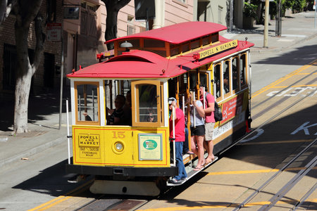 SAN FRANCISCO, USA - APRIL 8, 2014: People ride historic cable car in San Francisco, USA. Famous SF...