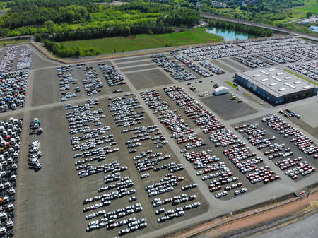Car factory parking lot. New car logistics center.