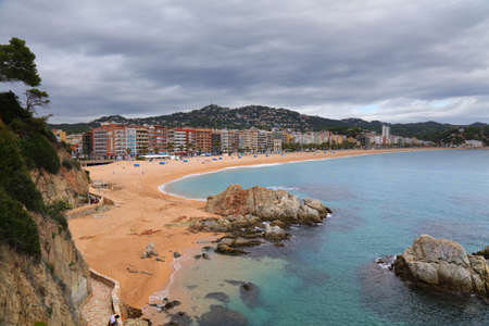 Lloret de Mar beach cityscape in Spain. View on a cloudy, rainy day.の写真素材