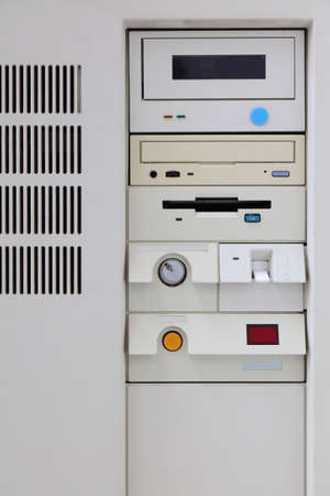 Obsolete PC computer case front view. White old computer with CD-ROM drive and floppy disk drive.の写真素材