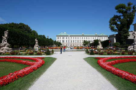 SALZBURG, AUSTRIA - AUGUST 6, 2008: People visit Mirabell Palace in Salzburg, Austria. The Old Town of Salzburg is a UNESCO World Heritage Site.のeditorial素材
