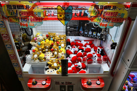 KYOTO, JAPAN - NOVEMBER 27, 2016: Claw machines with Rilakkuma toys at a game arcade in Kyoto, Japan. Claw machines in Asia are also known as UFO catchers.のeditorial素材