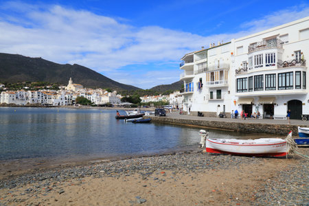 CADAQUES, SPAIN - OCTOBER 5, 2021: People visit picturesque fishing harbor of Cadaques in Catalonia region of Spain. The town is located in Alt Emporda county of Catalonia, Spain.のeditorial素材