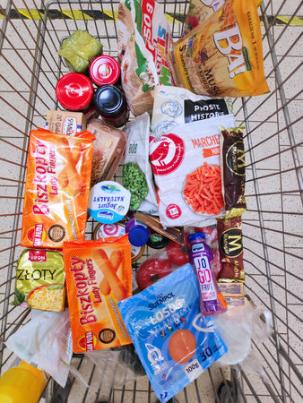 WARSAW, POLAND - MAY 8, 2021: Shopping cart in Auchan supermarket in Warsaw, Poland. Auchan has over 100 supermarkets and hypermarkets in Poland.のeditorial素材