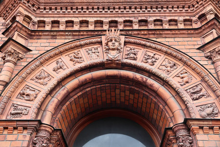 Zodiac decor on a terracotta brick old apartment building in Stockholm, Sweden.のeditorial素材