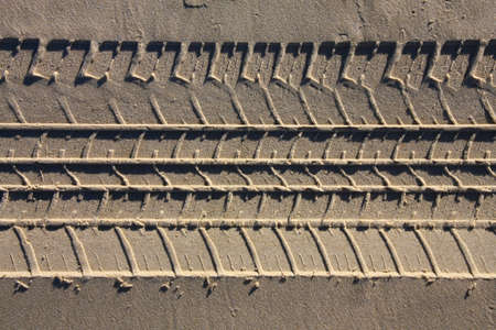 Car tyre tracks in the sand. Beach vehicle tracks.の写真素材