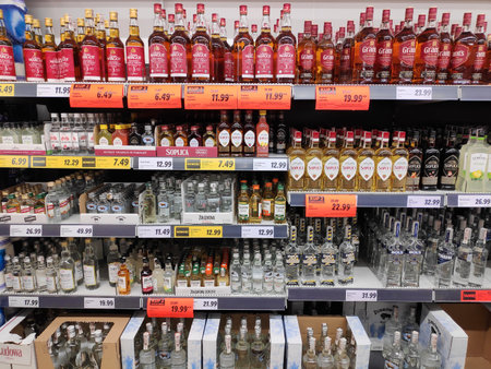 WARSAW, POLAND - NOVEMBER 27, 2021: Alcohol prices in a Lidl supermarket in Warsaw, Poland. Lidl is present in 29 European countries, with more than 630 locations in Poland.のeditorial素材
