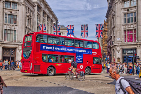 LONDON, UK - JULY 7, 2016: People shop at Oxford Street in London. Oxford Street (crossing Oxford Circus) has approximately half a million daily visitors and 320 stores.のeditorial素材