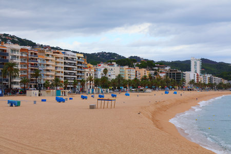 Lloret de Mar beach cityscape in Spain. View on a cloudy, rainy day.のeditorial素材
