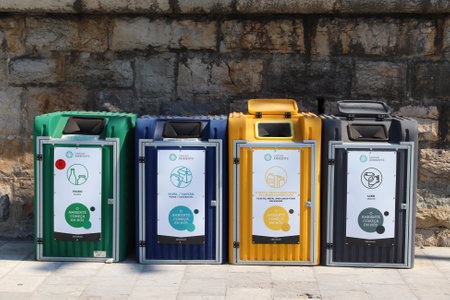 CASCAIS, PORTUGAL - MAY 21, 2018: Waste sorting local community dumpsters in Cascais, Portugal.のeditorial素材