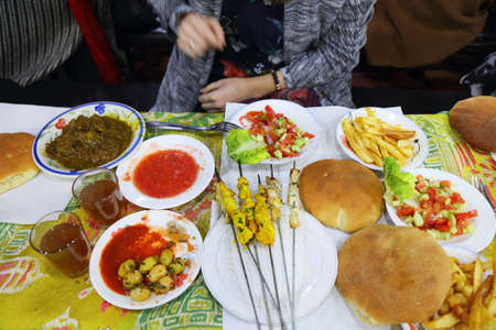 Tangia, Moroccan salad and barbecued meat skewers. Food of Jamaa El-Fnaa market in Marrakech....