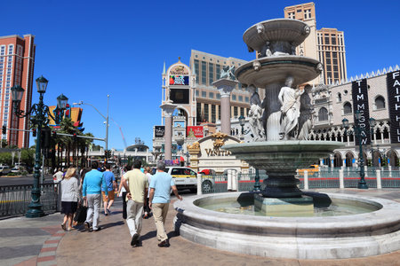 LAS VEGAS, USA - APRIL 14, 2014: People visit the Las Vegas Strip. 15 of 25 largest hotels in the world are located at the strip with more than 60 thousand rooms.のeditorial素材