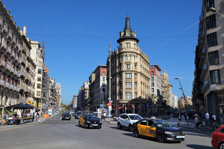 BARCELONA, SPAIN - OCTOBER 7, 2021: Traffic in Eixample district in Barcelona, Spain. Barcelona is the 2nd largest city in Spain.のeditorial素材