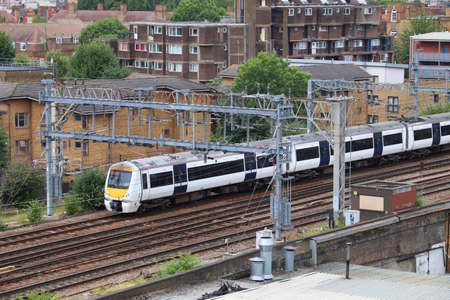 Regional train in suburbs of London UK. Passenger transportation in England.
