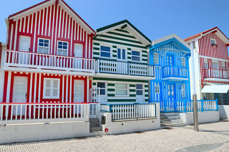 Striped homes of Costa Nova, Portugal - traditional local architecture. House decoration of colorful vertical stripes.の写真素材