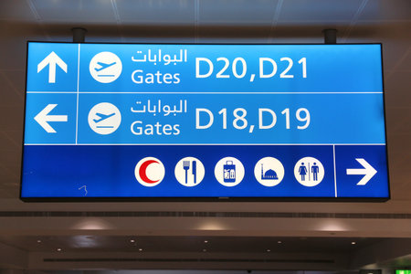 DUBAI, UAE - NOVEMBER 23, 2017: Gate signs at Dubai International Airport, United Arab Emirates. It is one of busiest airports in the world.のeditorial素材