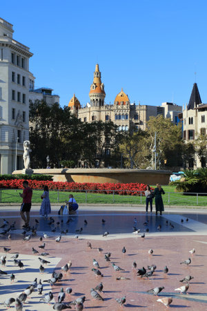 BARCELONA, SPAIN - OCTOBER 7, 2021: People visit Placa de Catalunya public square in Barcelona, Spain. Barcelona is the 2nd largest city in Spain.のeditorial素材