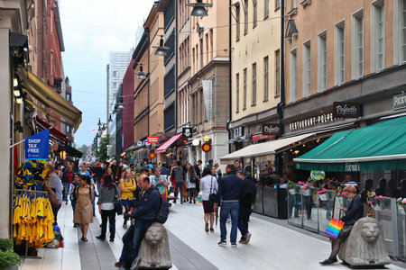 STOCKHOLM, SWEDEN - AUGUST 24, 2018: People visit Drottninggatan shopping street in Norrmalm district, Stockholm, Sweden. Stockholm is the capital city and most populous area in Sweden.のeditorial素材