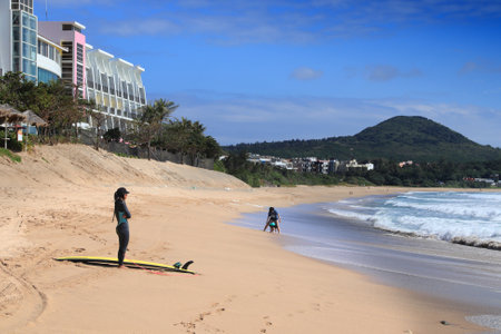 KENTING, TAIWAN - NOVEMBER 27, 2018: Surfer observes the waves in Kenting, Taiwan. Kenting National Park is a popular taiwanese beach destination.のeditorial素材