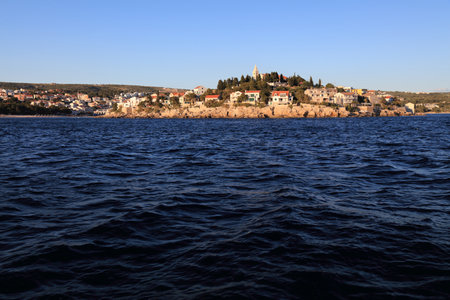 Croatia Primosten town. Coastal town of Primosten in sunset light.