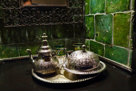 Moroccan silver teapot, tray and plateau set. Serving of Moroccan mint tea.