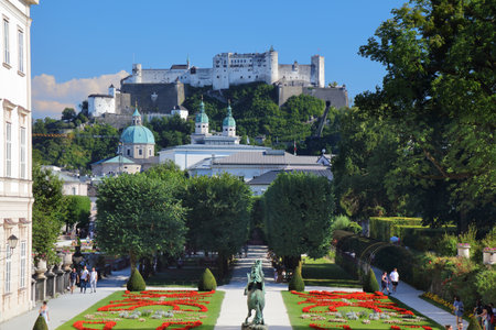 SALZBURG, AUSTRIA - AUGUST 4, 2022: People visit Mirabell Garden in Salzburg, Austria. Salzburg Old Town is a UNESCO World Heritage Site.のeditorial素材