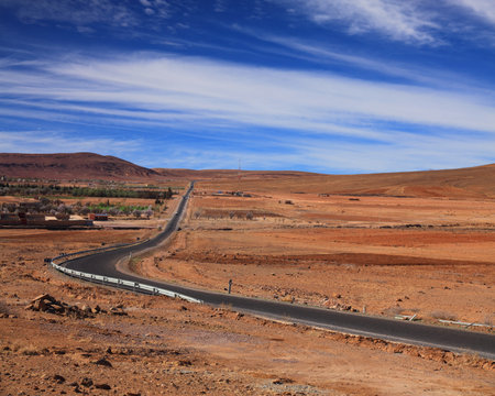 Moroccan desert road in Ouarzazate province. Road curve.の写真素材