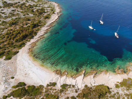 Zirje island in Croatia. Paradise cove with sailing yachts. Drone view of Croatia.の写真素材