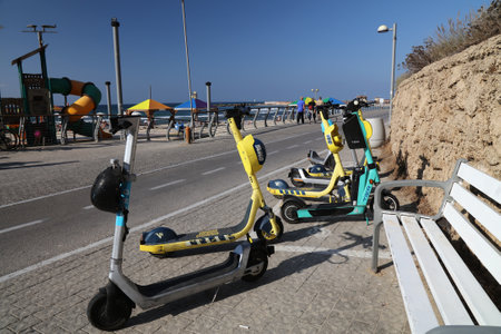 TEL AVIV, ISRAEL - NOVEMBER 3, 2022: Yango, Wind, Tier and Bird electric scooters for rent parked in Tel Aviv, Israel. Tel Aviv-Yafo is the economic center of Israel.のeditorial素材