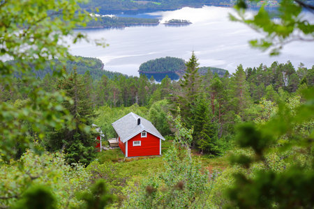 Norway Sunnmore district landscape. View from Nihusen mountain in Skodje municipality. Red vacation cabin (hytte).の写真素材