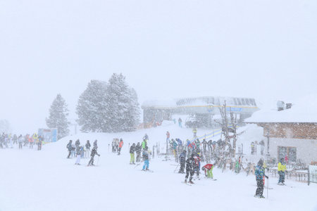 MAYRHOFEN, AUSTRIA - MARCH 15, 2019: People visit Mayrhofen ski resort during heavy snowfall in Tyrol region, Austria. The resort is located in Zillertal valley of Central Eastern Alps (Zentralalpen).のeditorial素材